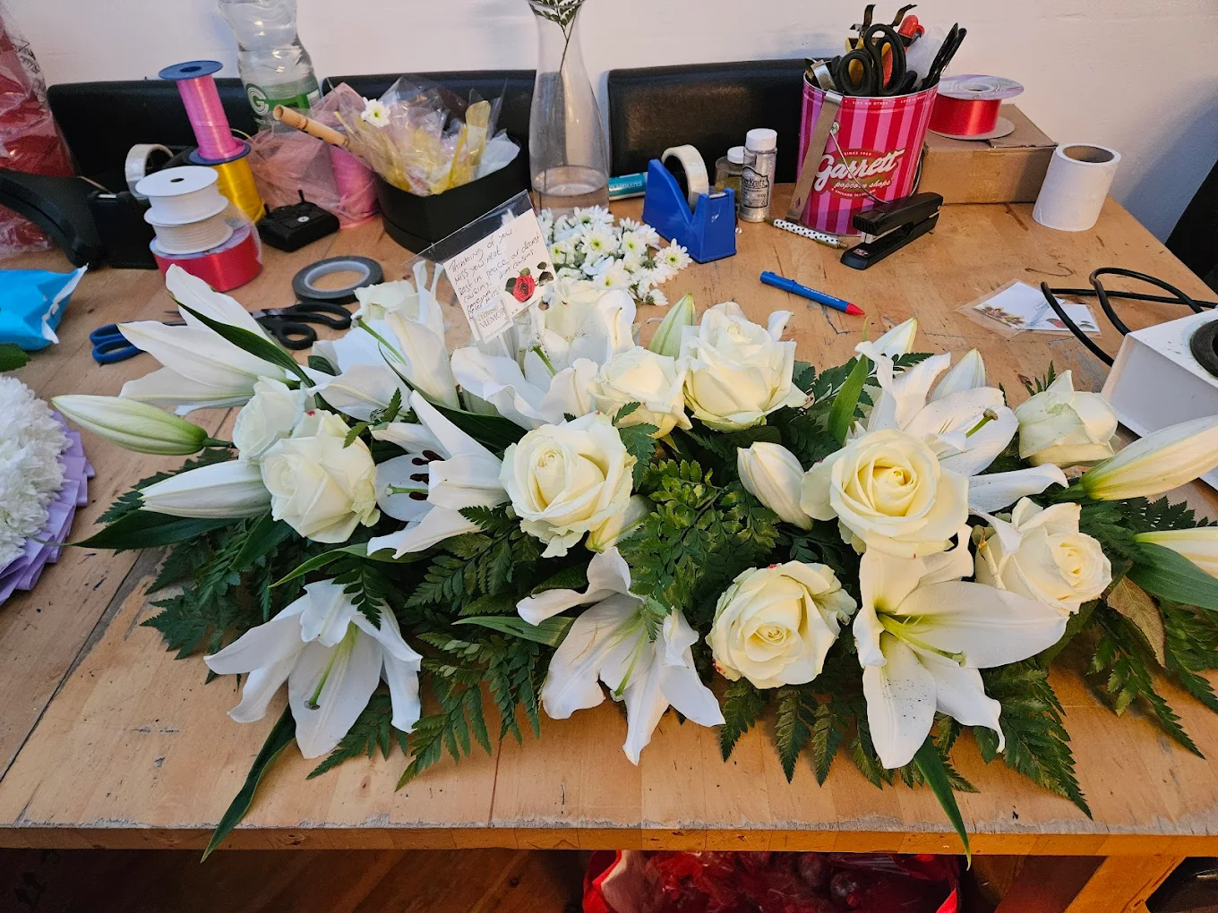 Mother's Day lily and rose arrangement from Anne's Florist.